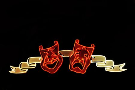 Neon sign with smiling and unhappy faces over blackの写真素材