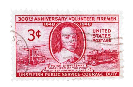 United States- Circa 1948 : A vintage US postage stamp image of a Peter Stuyvesant and fire vintage engines, value of 3 cents, inscription の写真素材