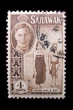 SARAWAK - CIRCA 1940: Depicting indigenous people and an inset of King George VI, with insciption のeditorial素材