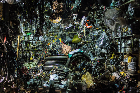 PHNOM PENH, CAMBODIA - AUGUST 11, 2015: Piles of auto parts in the Russian market in Phnom Penh.のeditorial素材