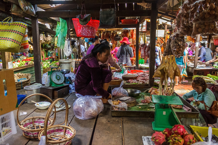 PHNOM PENH, CAMBODIA - AUGUST 11, 2015: A market vendor waits for customers in the Russian market in Phnom Penh.のeditorial素材