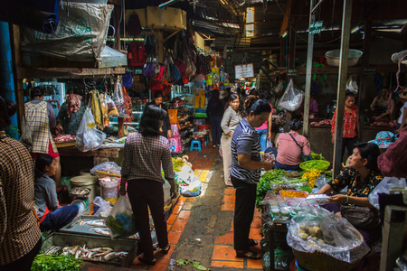 PHNOM PENH, CAMBODIA - AUGUST 11, 2015: Customers browse the varius stalls in the Russian market in Phnom Penh.のeditorial素材
