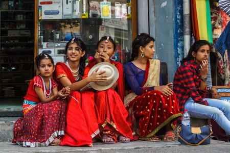 POKHARA, NEPAL - 11/9/2015: Girls in traditional clothes during the Tihar festival in Pokhara, Nepal.のeditorial素材