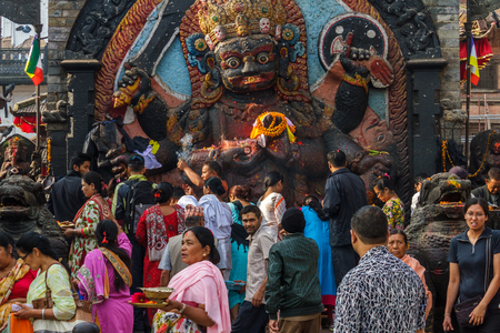 KATHMANDU, NEPAL - 9/26/2015: Devotees make offerings at Durbar Square during the Indra Jatra festival in Kathmandu, Nepal.のeditorial素材