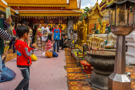 CHIANG MAI, THAILAND - 12/8/2014: Buddhists pray and make lotus flower offerings at Wat Phra That Doi Suthep.のeditorial素材