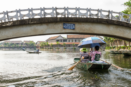 NINH BINH, VIETNAM - 5/6/2016: Boats on the Ngo Dong River, entering Tam Coc village, at the Trang An UNESCO World Heritage site in Ninh Binh, Vietnam.のeditorial素材