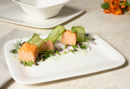 Grilled salmon salad angled view platedの写真素材