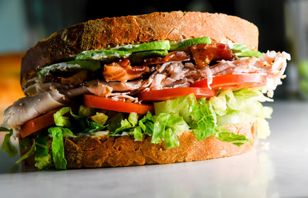 Turkey club sandwich close-up view with bacon, lettuce, tomato, turkeyの写真素材