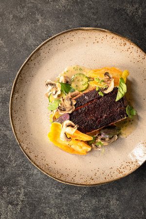 Hibiscus grilled salmon plated on table above viewの写真素材