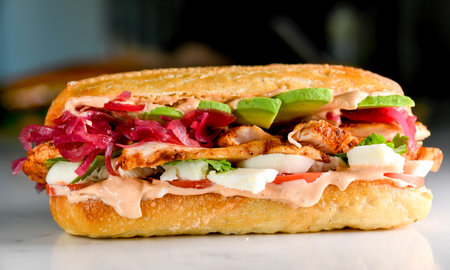 Roasted chicken sandwich with spicy aoli and pickles onionsの写真素材