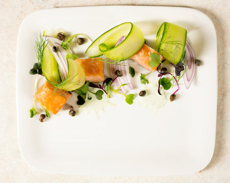 Grilled salmon salad above view platedの写真素材