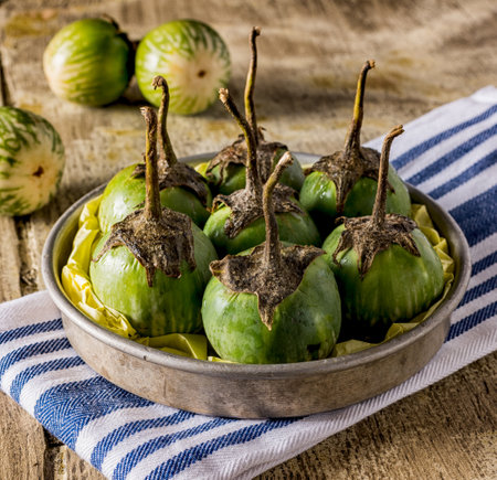 Green thai eggplants on table with table clothの写真素材