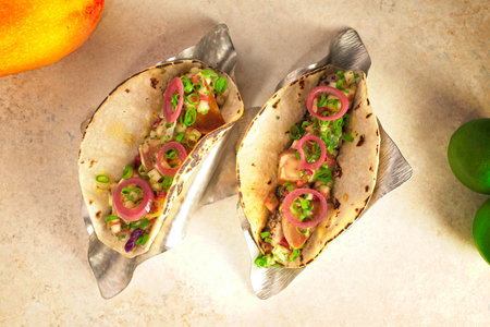 Seafood tacos with pickled onions, plated on tableの写真素材