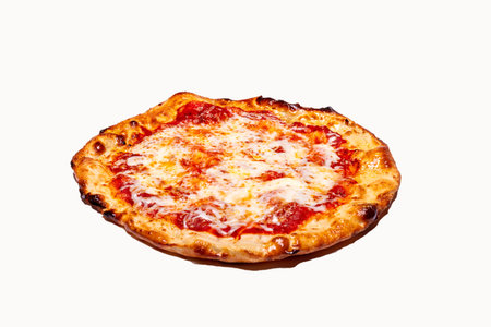 A saucy and cheesy whole pizza with crispy crust on a white backgroundの写真素材