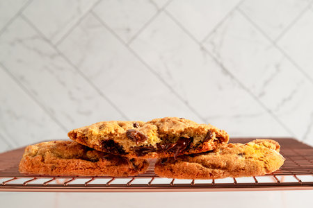 Freshly baked chocolate chip cookies on oven trayの写真素材