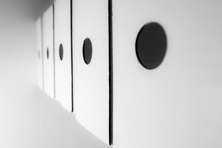 Abstract files holder white background with black hole and lineの写真素材