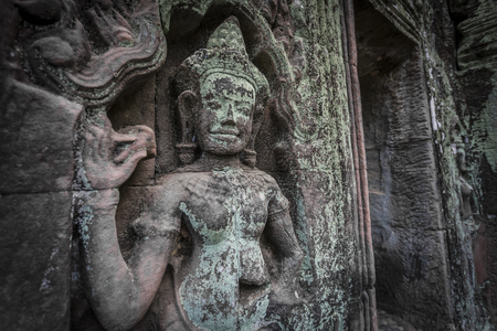 Siem Reap Angkor Wat apsara dancer ancient stone carving on wall and pillarの写真素材