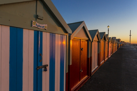Brighton colorful beach hut beach house along the coast of Brighton Pier.のeditorial素材