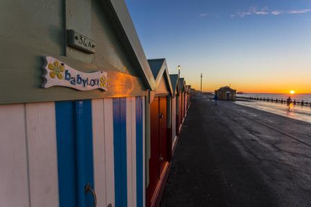 Brighton colorful beach hut beach house along the coast of Brighton Pier.のeditorial素材