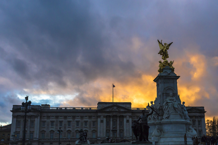 The Queen Victoria Memorial. The Queen Victoria Memorial is located in front of Buckingham Palace and comprises of the Dominion Gates, the Memorial Gardens and a vast central monument commemorating the death of Queen Victoria in 1901.の写真素材