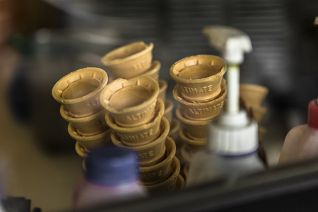 Ice cream icecream cone stacked up with tip facing downの写真素材