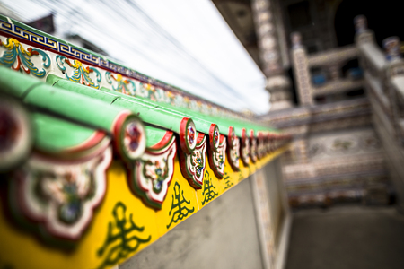 Chinese buddhist temple wall at Supasarnrangsan Road Hat Yai Songkhla  Thailandのeditorial素材