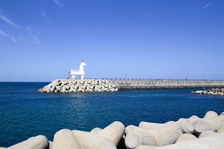 Iho Lighthouse at Iho Tewoo beach in the North of Jeju South Korea Asiaの写真素材