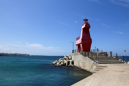 Iho Lighthouse at Iho Tewoo beach in the North of Jeju South Korea Asiaの写真素材