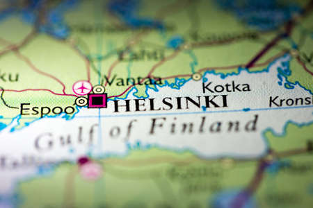 Shallow depth of field focus on geographical map location of Helsinki city Poland Europe continent...