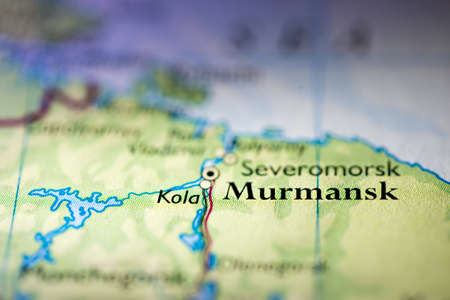 Shallow depth of field focus on geographical map location of Murmansk city Russia Europe continent...