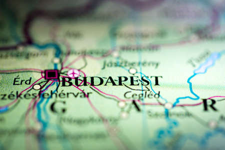 Shallow depth of field focus on geographical map location of Budapest city Hungary Europe continent on atlasの写真素材
