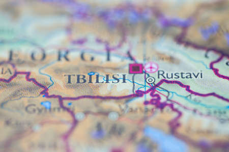 Shallow depth of field focus on geographical map location of Tbilisi city Georgia Europe continent on atlasの写真素材