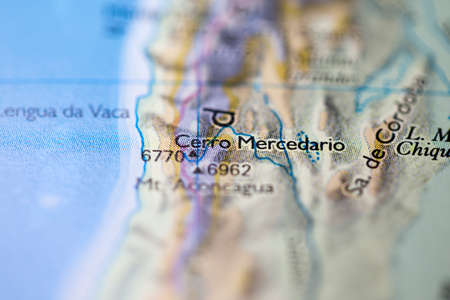 Shallow depth of field focus on geographical map location of Mount Cerro Mercedario in Argentina South America continent on atlasの写真素材