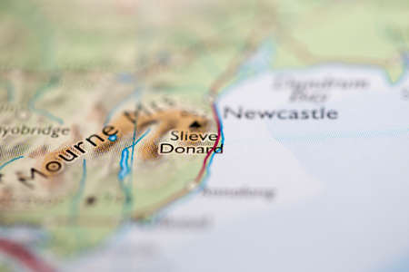Shallow depth of field focus on geographical map location of Mount Slieve Donard in Northern Ireland...