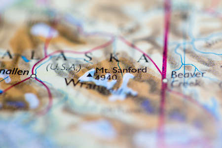 Shallow depth of field focus on geographical map location of Mount Sanford in United States North America continent on atlasのeditorial素材