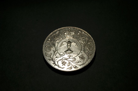 1977 Corwn coin showing Coronation Regalia with floral border  Crown above  No Inscription の写真素材
