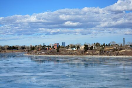 Icy lake view of park and cityの写真素材