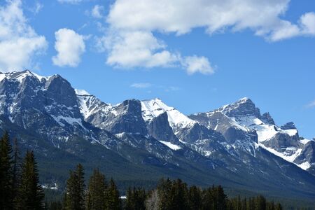 Snow-covered Rocky Mountains on a Summer Dayの写真素材