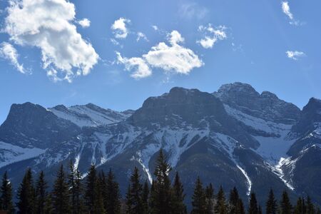 Snow-covered Rocky Mountains on a Summer Dayの写真素材