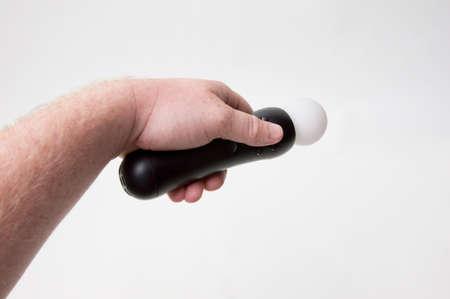 Hand holding a motion control.の写真素材