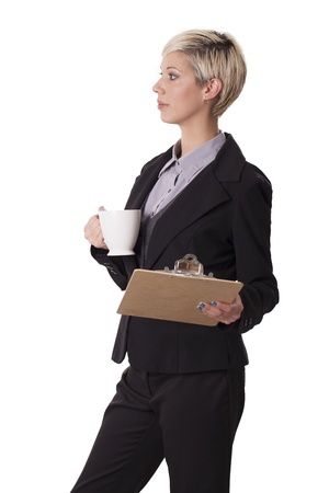 Trendy young woman with a coffee cup and clipboard の写真素材
