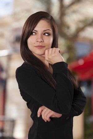 Beautiful business woman examines her surroundings の写真素材