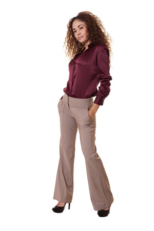 Ethnic woman stands confidently with hands in pockets の写真素材