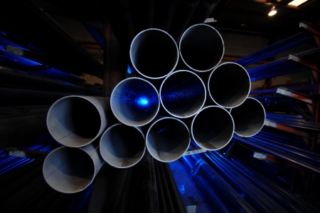 A collection of metal pipes and rods used in construction の写真素材