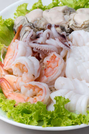 Steamed shrimp and squid and raw oyster with seafood sauce.
