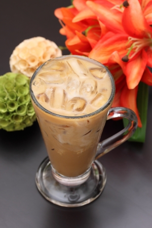 Glass of ice coffee and milk の写真素材