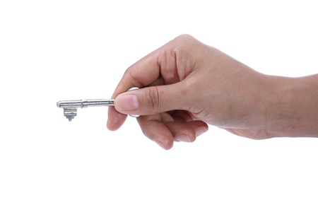 hand holding key on white backgroundの写真素材