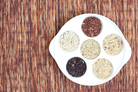 Mixed rice in tray on reed matの写真素材