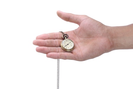 Male hand holding pocket watch isolated on white background