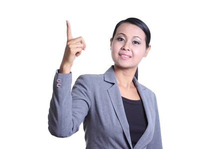 Business woman pointing at copyspace isolated on whiteの写真素材